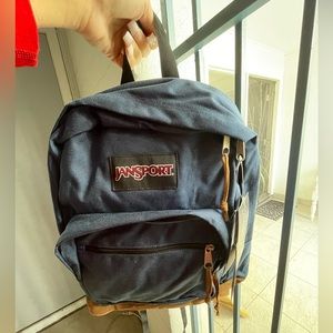 JanSport Right Pack Backpack Navy with leather bottom with 15” laptop sleeve.